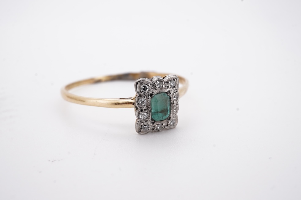 An 18ct and plat. five stone diamond set half hoop ring, size V together with a yellow metal emerald and diamond set tablet ring, size Z+++, gross weight 4.5 grams. Condition - fair